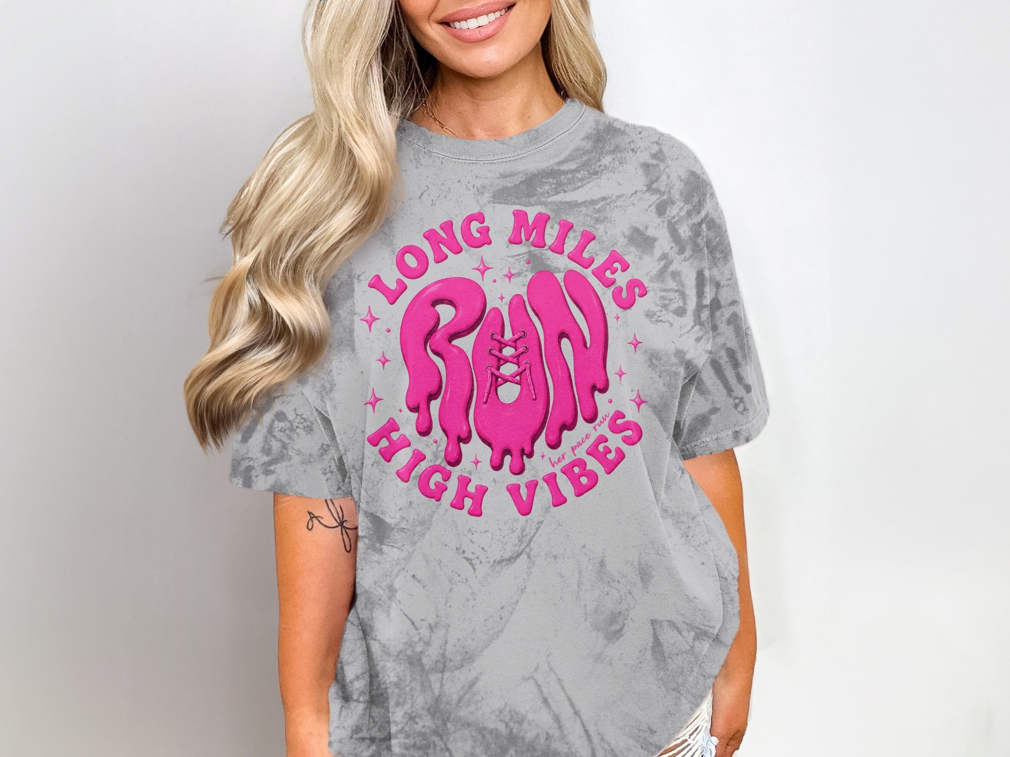 Gray tie-dye t-shirt with pink "LONG MILES RUN HIGH VIBES" graphic and shoe detail.