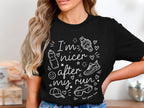 Black t-shirt with white text and graphics saying "I'm nicer after my run".