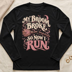 Black long sleeve shirt with "My broom broke so now I run" Halloween graphic.