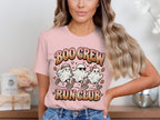 Pink t-shirt with cartoon ghosts running and "Boo Crew Run Club" text.