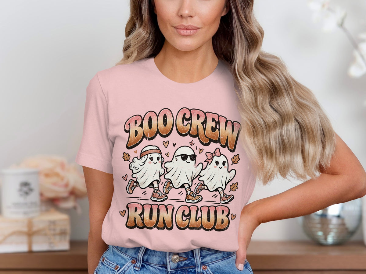 Pink t-shirt with cartoon ghosts running and "Boo Crew Run Club" text.