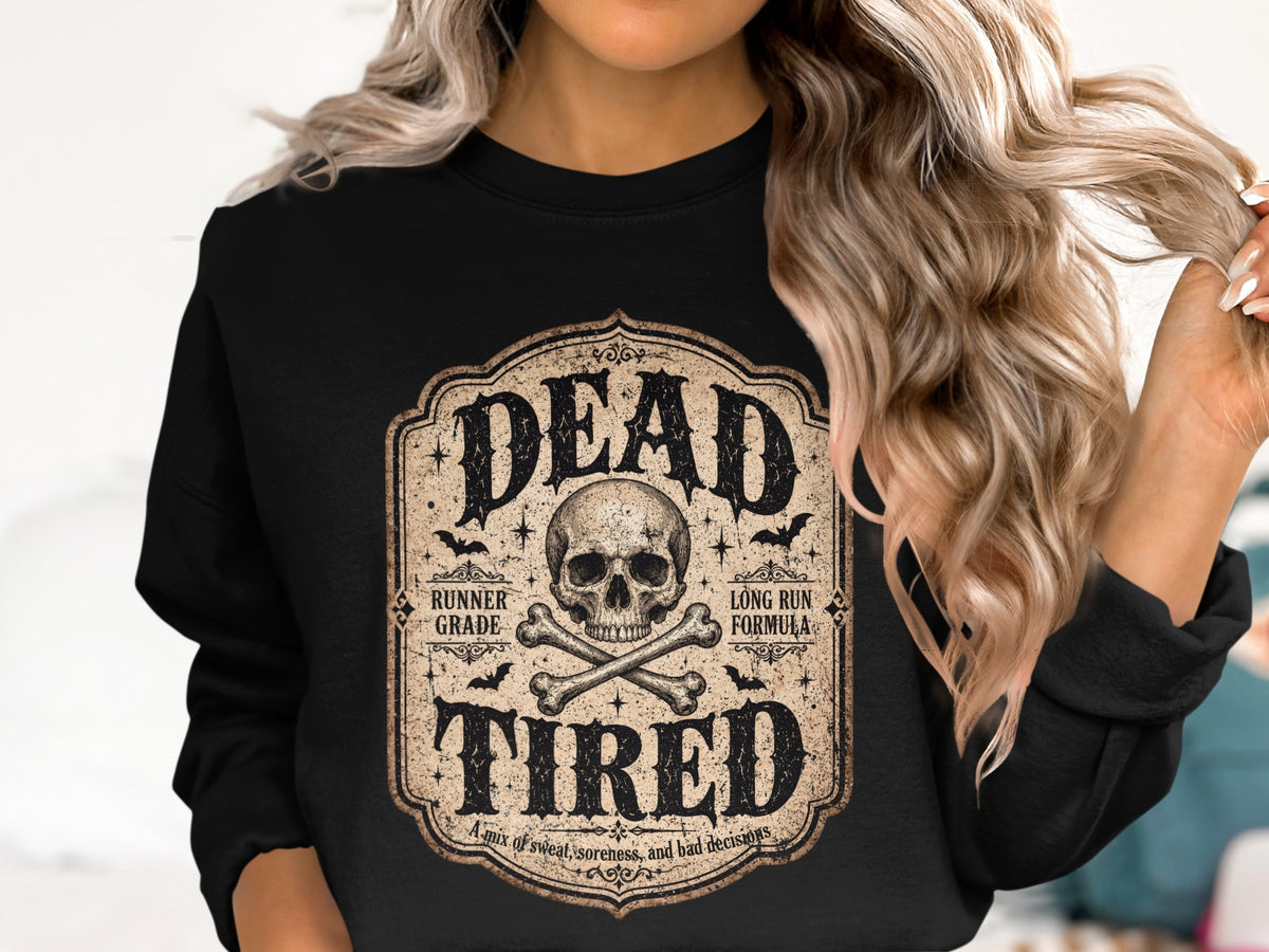 Black sweatshirt with "Dead Tired" design featuring a skull, crossbones, and bats.