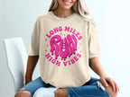 Cream t-shirt with pink "Long Miles Run High Vibes" graphic and stars.