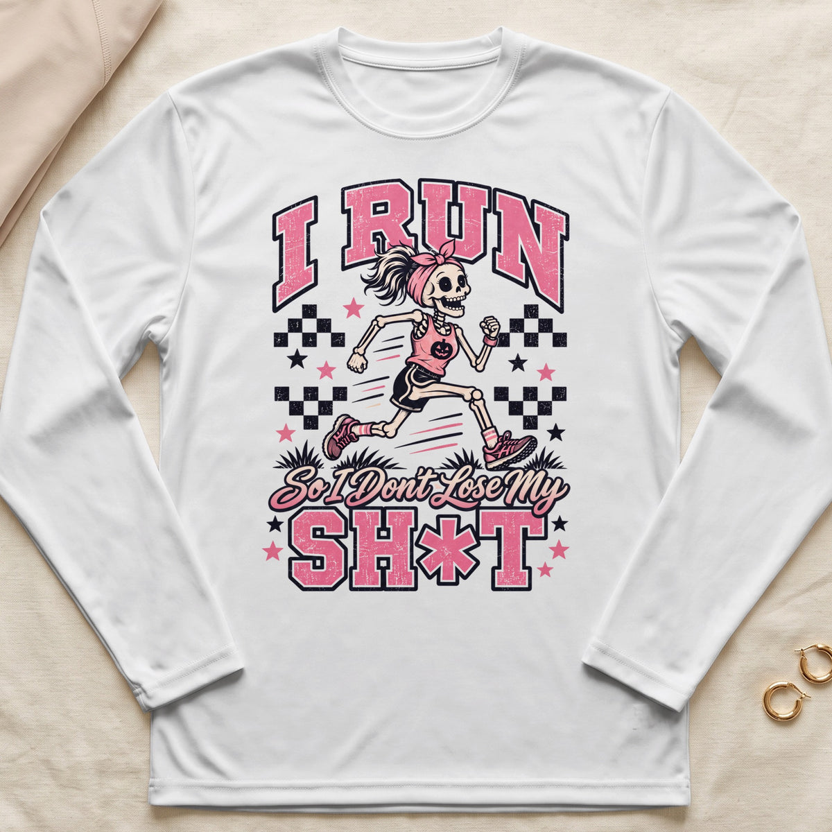 White long sleeve shirt with pink text and skeleton runner graphic.