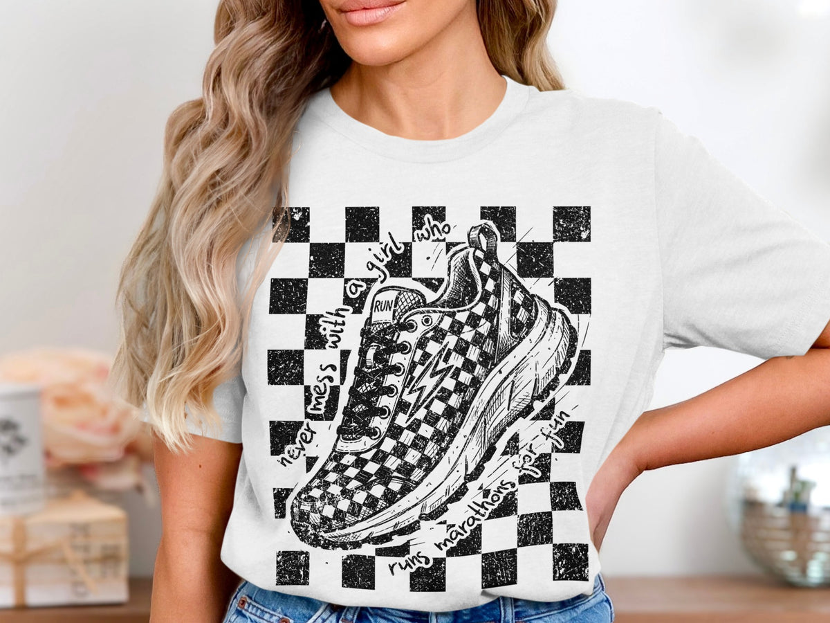 T-shirt with checkered sneaker graphic and text "never mess with a girl who runs marathons for fun".