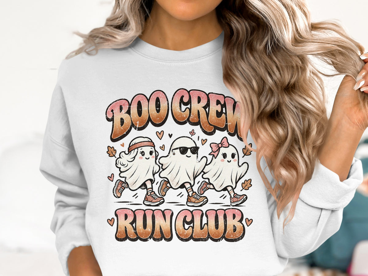 Three cartoon ghosts with "Boo Crew Run Club" text on a white sweatshirt.