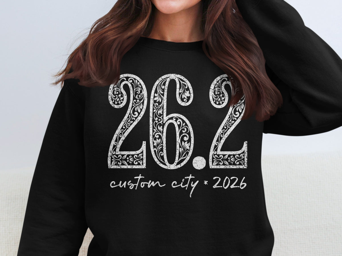 Black sweatshirt with white text "26.2 custom city * 2026"
