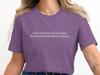Purple t-shirt with white text: "i have the kind of trauma where doing hard things feels like healing."