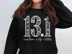 Black sweatshirt with "13.1 custom city * 2026" design.