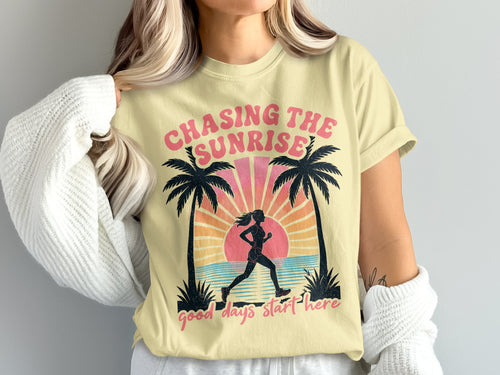 Yellow t-shirt with runner graphic and text "Chasing the Sunrise good days start here".