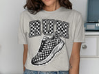 Light grey t-shirt with "RUN" in checkered lettering and a checkered athletic shoe graphic.