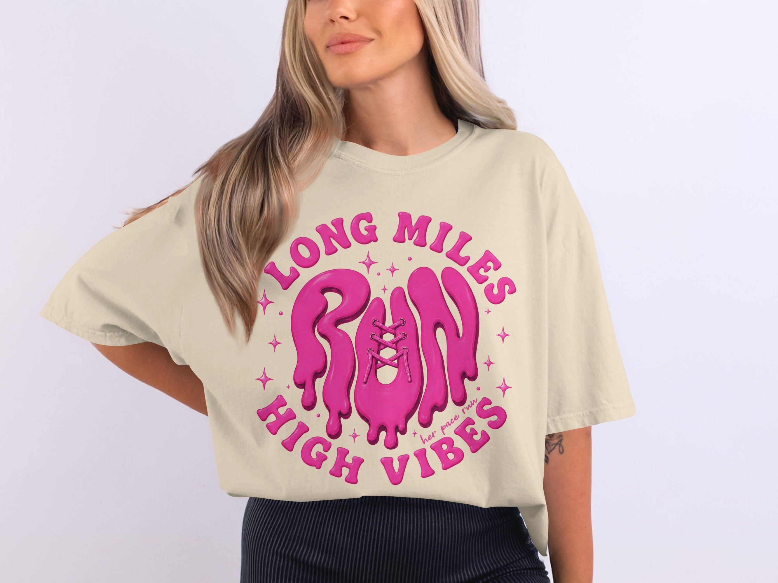 Cream t-shirt with pink graphic text reading "LONG MILES RUN HIGH VIBES" with shoelaces.
