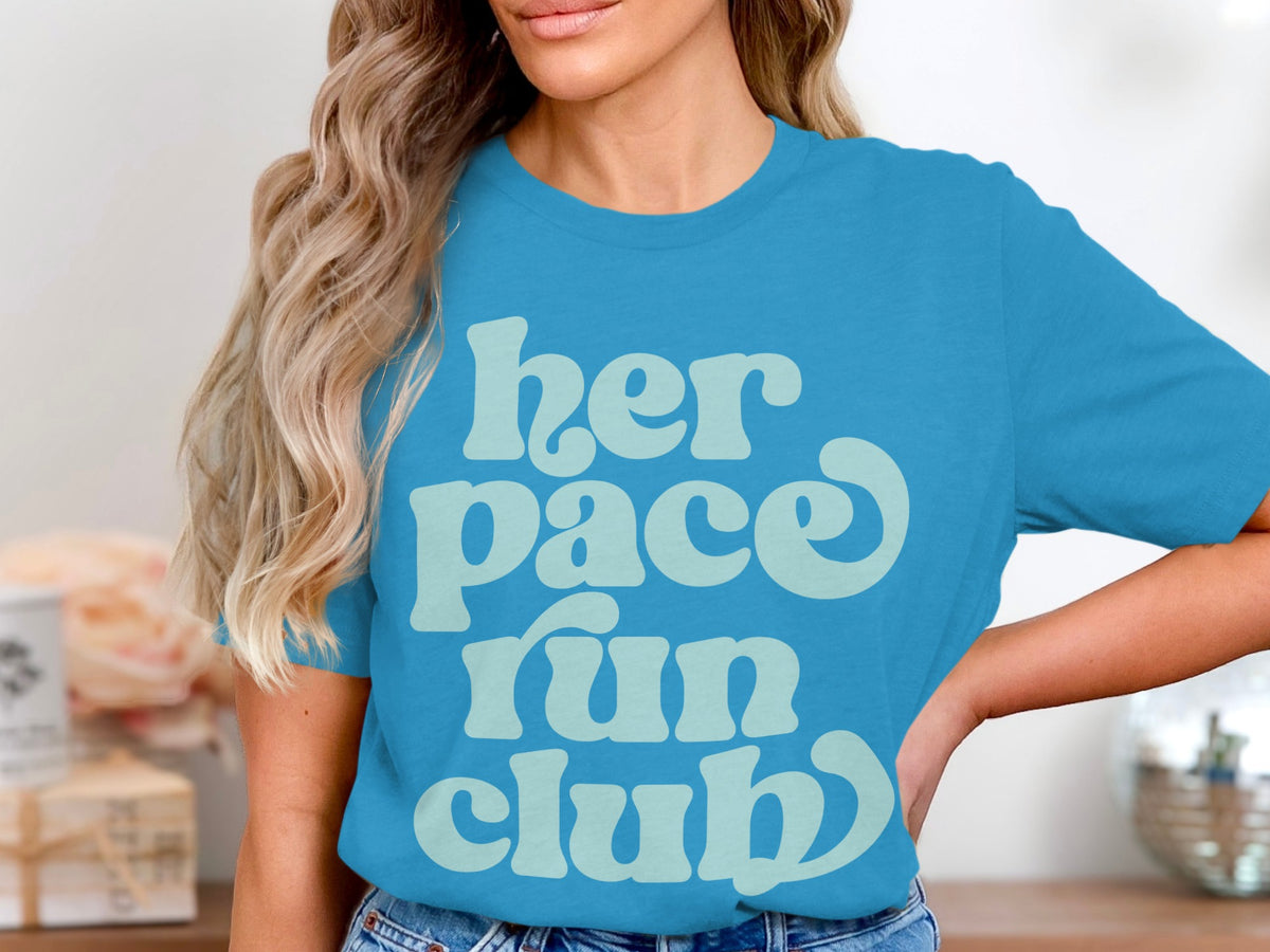 Blue t-shirt with light blue text "her pace run club"