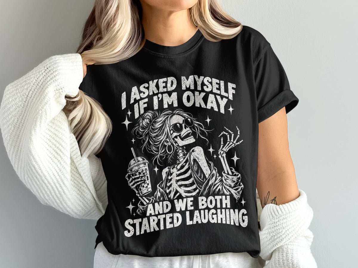 Black t-shirt with skeleton graphic and text: "I asked myself if I'm okay and we both started laughing."