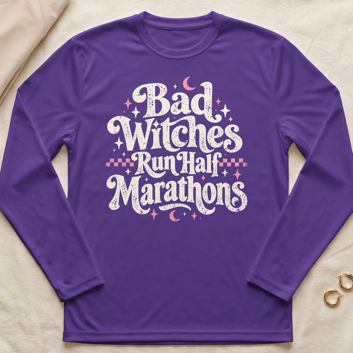 Purple long-sleeve shirt with "Bad Witches Run Half Marathons" text.