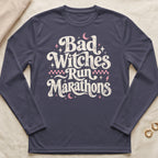 Dark long-sleeve shirt with "Bad Witches Run Marathons" text design.