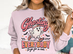 Pink sweatshirt with running ghost graphic and text "Ghosting Everybody to go for a run".