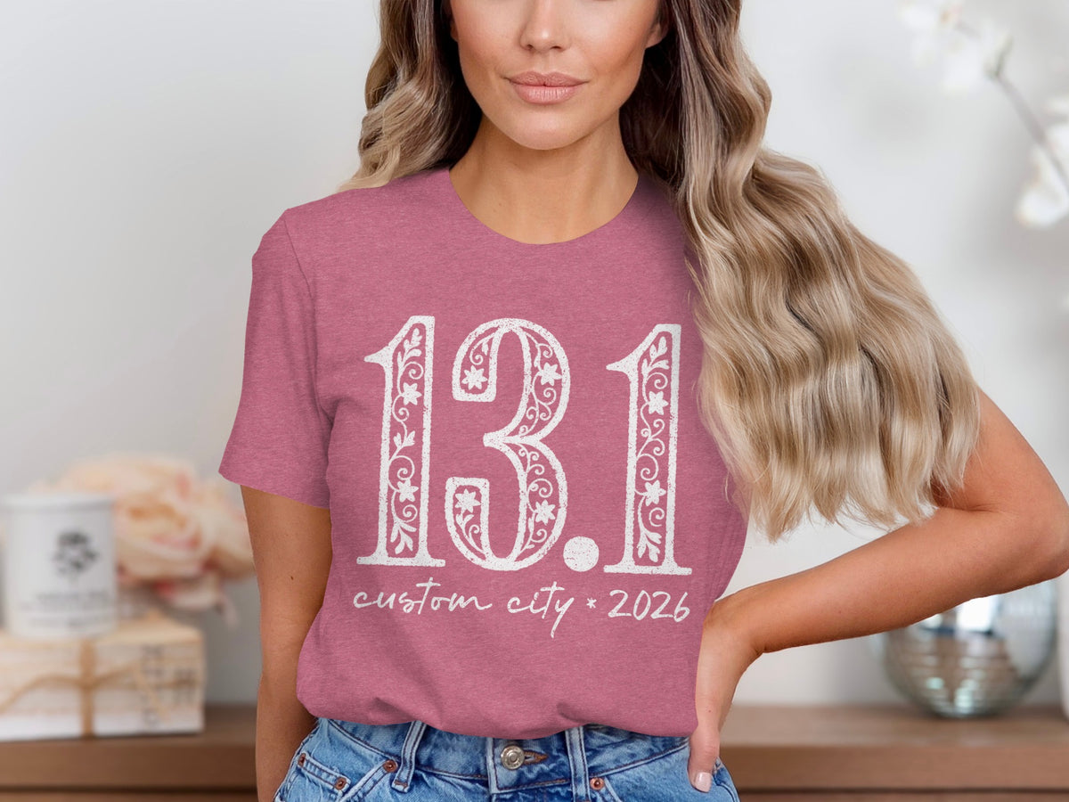 Rose t-shirt with white 13.1, custom city, and 2026 text.