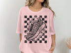 Pink t-shirt with checkered shoe graphic and text "never mess with a girl who runs marathons for fun".