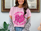 Pink t-shirt with dripping pink graphic text "LONG MILES RUN HIGH VIBES".