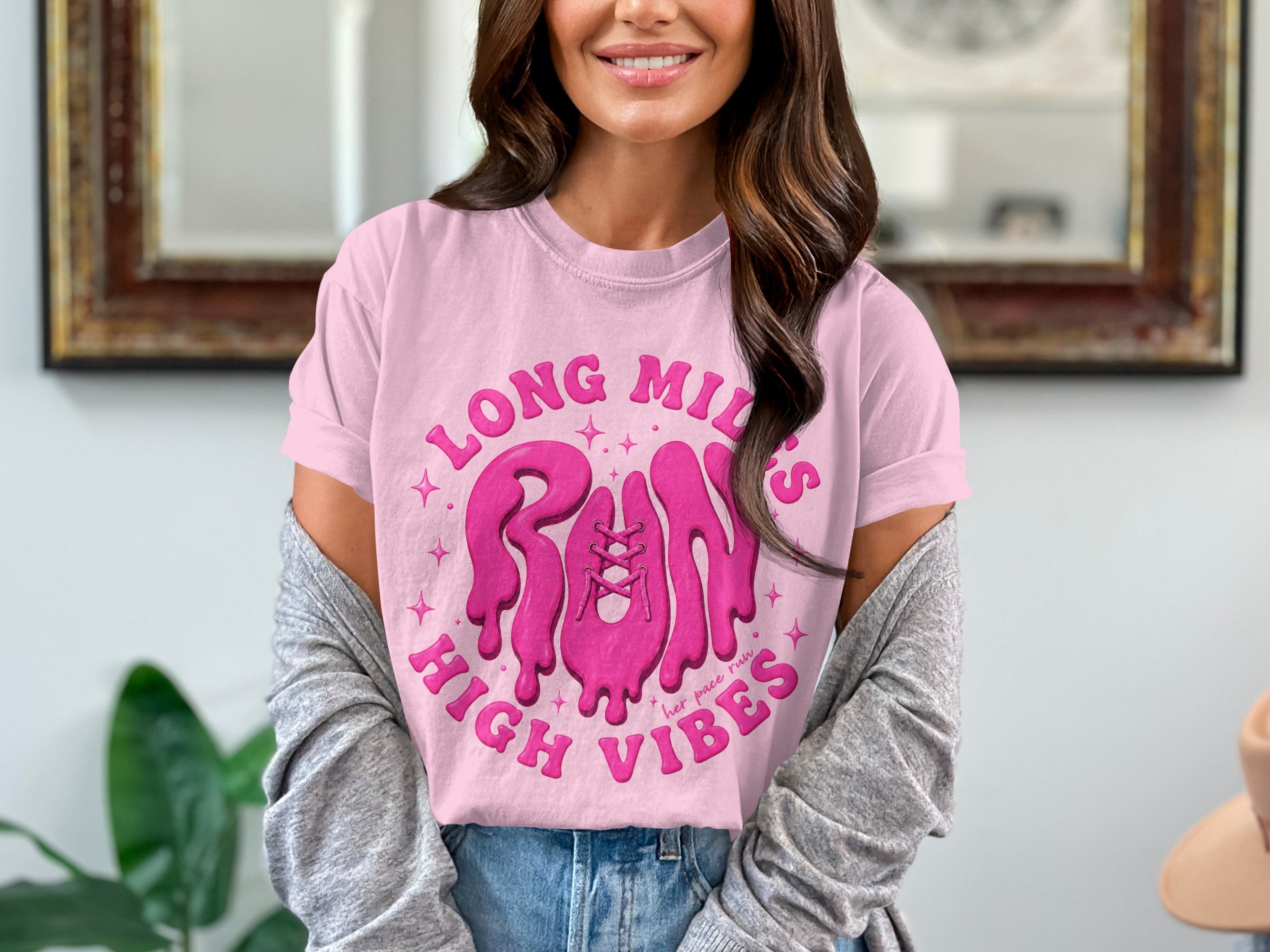 Pink t-shirt with dripping pink graphic text "LONG MILES RUN HIGH VIBES".