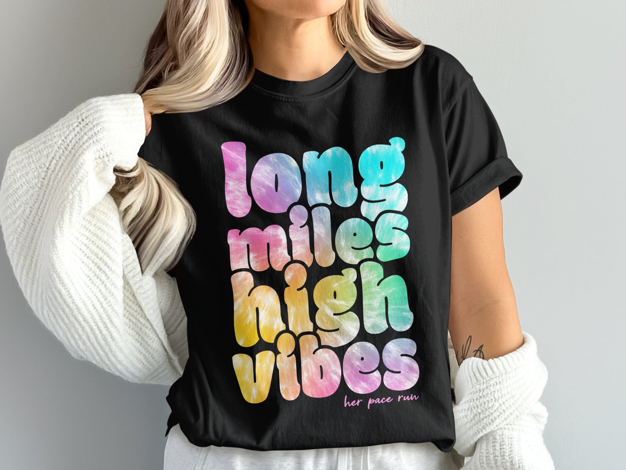 Black t-shirt with tie-dye text reading "Long Miles High Vibes".