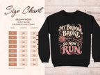 Gildan 18000 heavy blend crewneck sweatshirt size chart with "My Broom Broke So Now I Run" graphic.