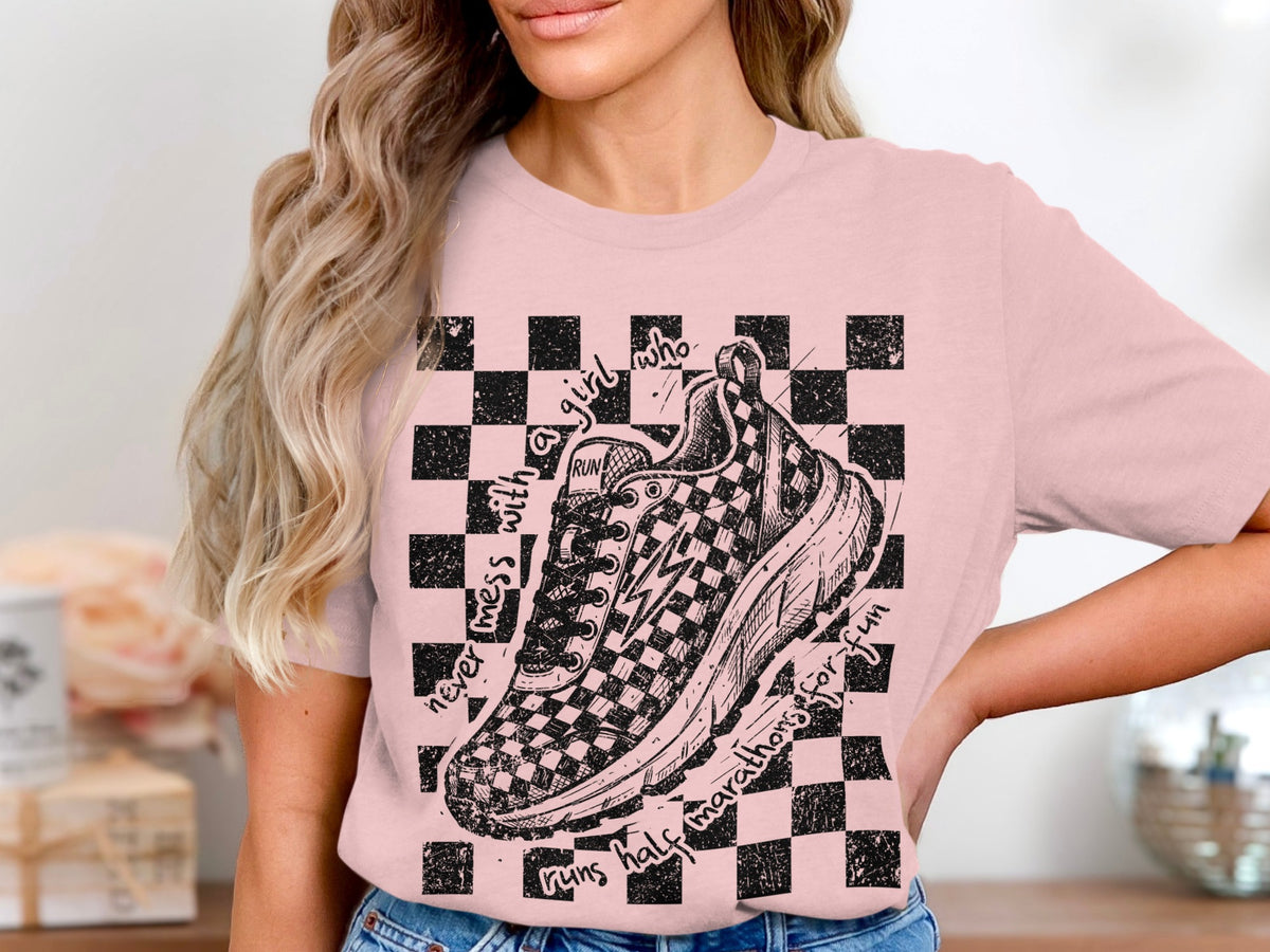 Pink t-shirt with checkered graphic, running shoe, and text.