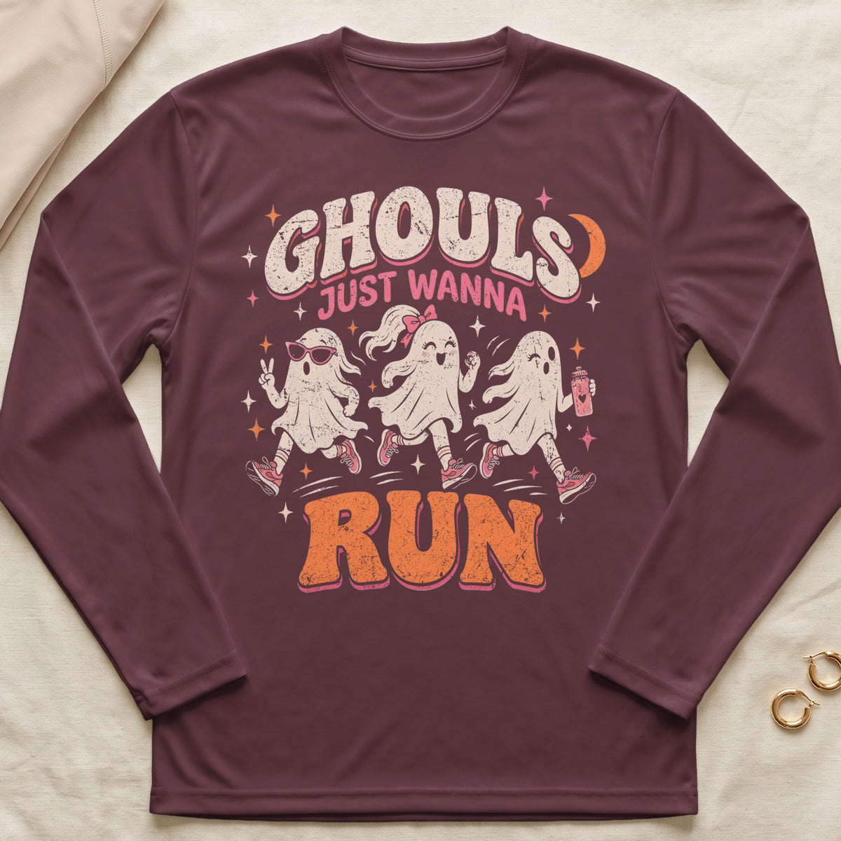 Ghouls Just Wanna Run graphic on a maroon long-sleeve shirt.
