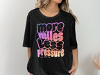 Black t-shirt with "more miles less pressure her pace run" in colorful text.