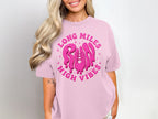 Pink t-shirt with "Long Miles Run High Vibes" graphic featuring a dripping shoe.